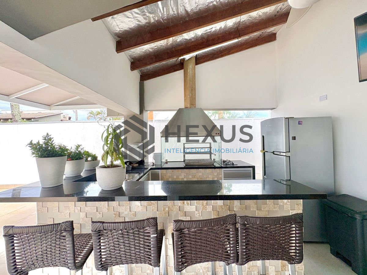 Foto 5 de Casa reformada com piscina e área gourmet no Jardim Acapulco, Guarujá