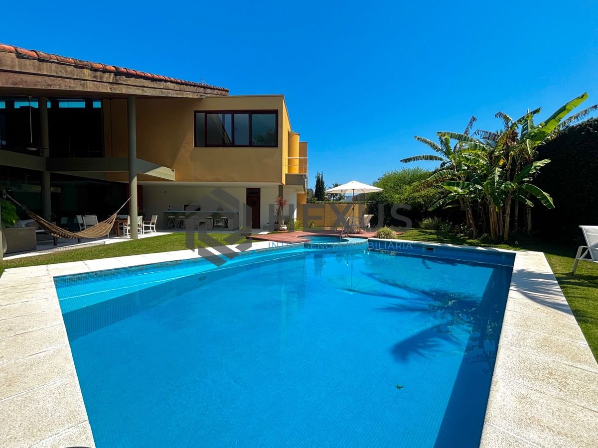 Foto 8 de Casa reformada com piscina e área gourmet no Jardim Acapulco, Guarujá