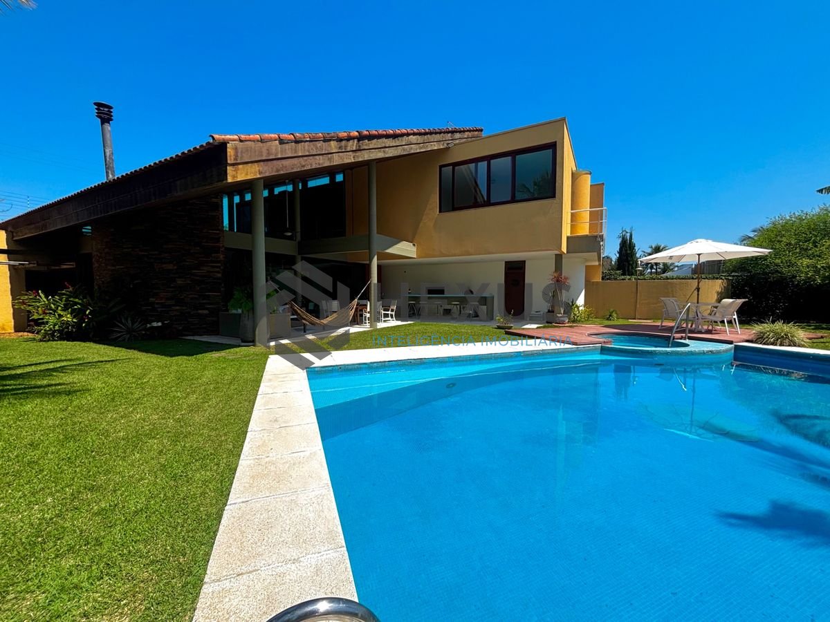 Foto 10 de Casa reformada com piscina e área gourmet no Jardim Acapulco, Guarujá