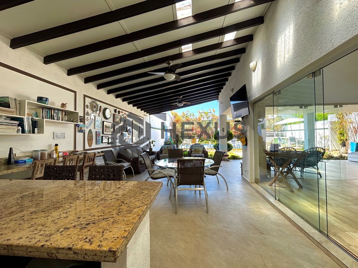 Foto 4 de Casa reformada com piscina e área gourmet no Jardim Acapulco, Guarujá