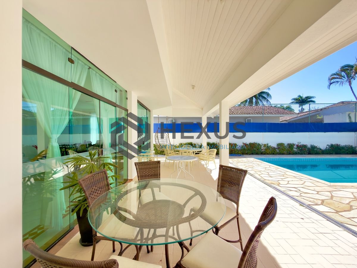 Foto 3 de Casa reformada com piscina e área gourmet no Jardim Acapulco, Guarujá