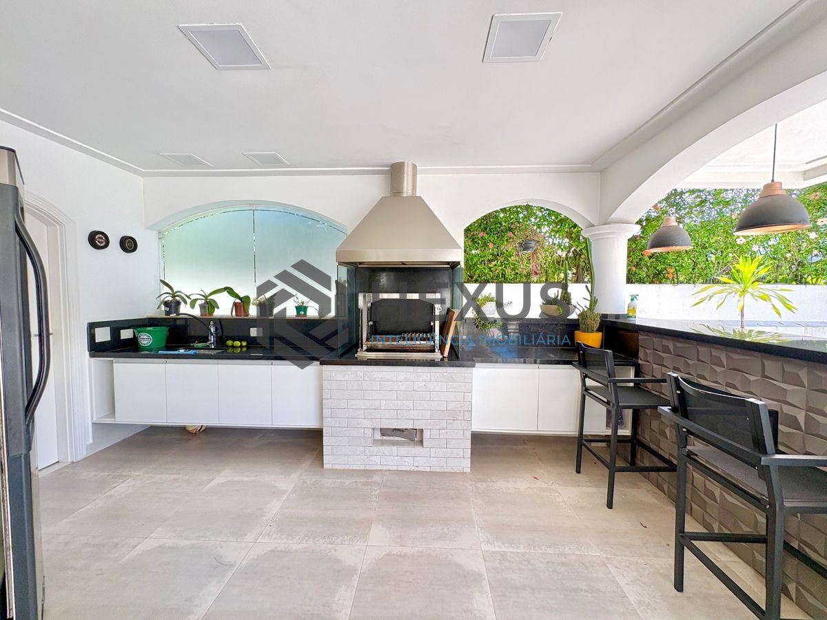 Foto 5 de Casa reformada com piscina e área gourmet no Jardim Acapulco, Guarujá